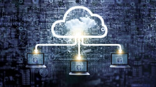 Three laptops connected to a cloud icon, each displaying a padlock, symbolizing remote browser isolation deployment that helps defend against phishing attacks.